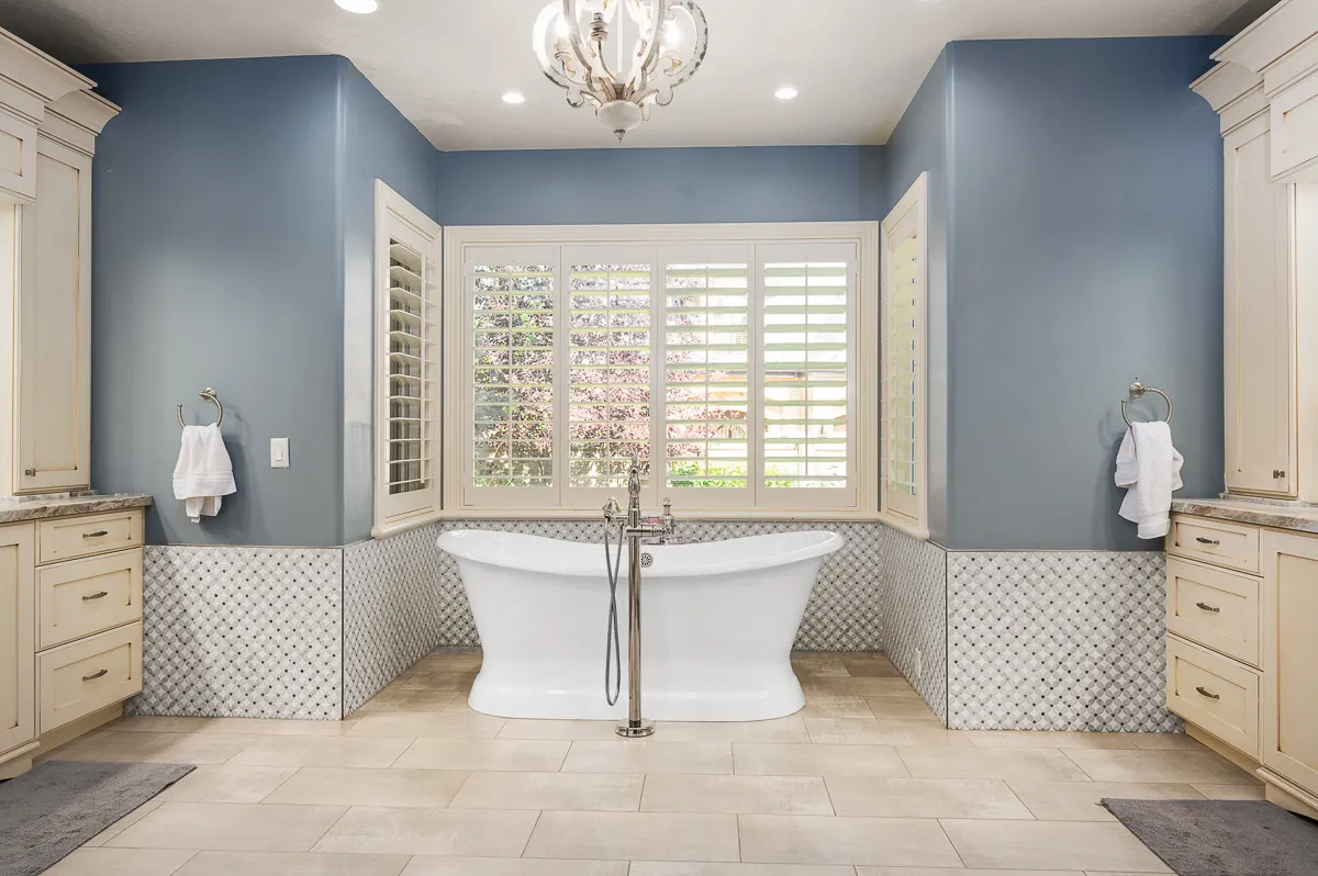 Renovated primary bathroom in the Updated Old World project by Lisa Marie Design Co.